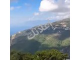 للبيع ارض في ناحية كسب  نبع تشالما اطلالة على بحر السمرا 